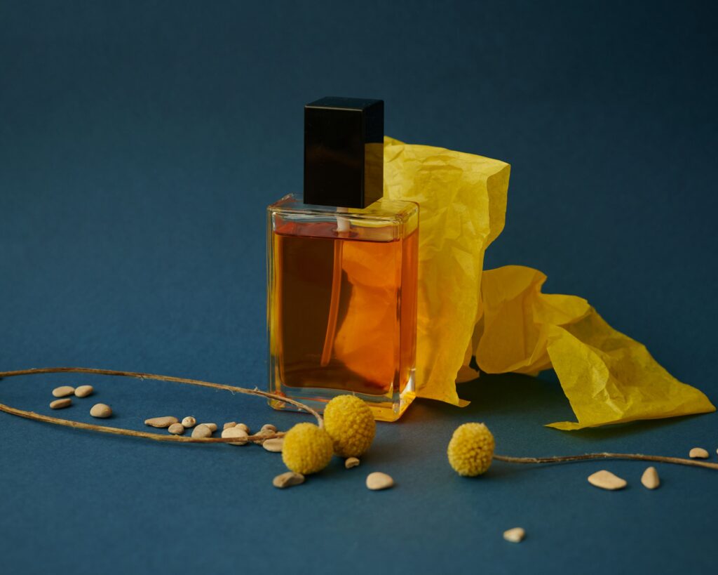 unlabeled perfume bottle with yellow flowers