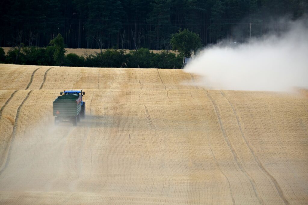 Truck spraying pesticides in field