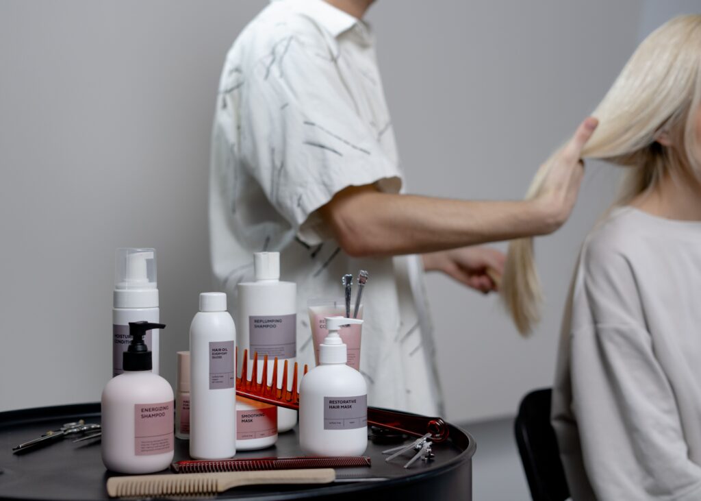 hair salon scene with products on side table