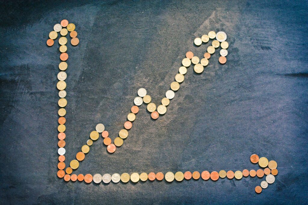 Graphic of trend line going up made of pennies.