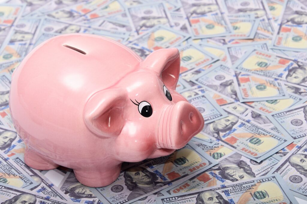 piggy bank over money